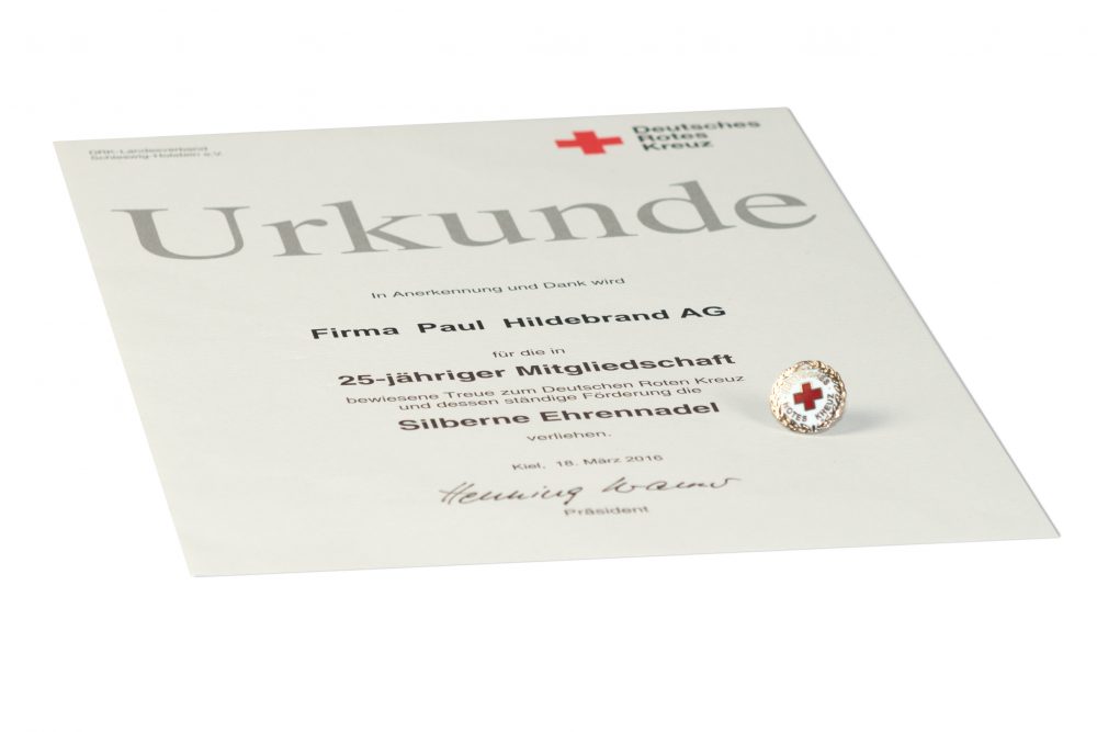 Urkunde und Silberne Ehrennadel des DRK für die Paul Hildebrandt AG